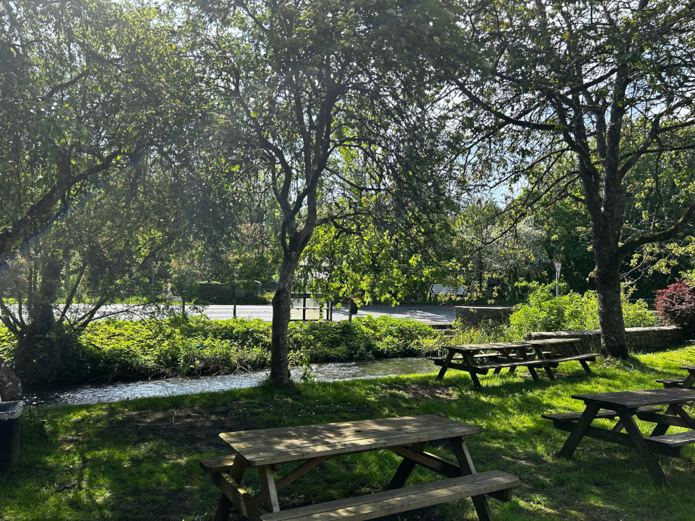 garden view from bathurst arms with benches and river